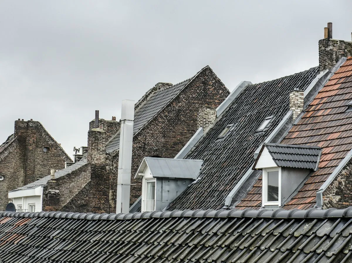 Roof Replacement in Rialto — steep shingle and slate roofs in an older neighborhood